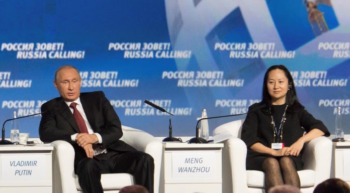 Russia's President Vladimir Putin and Huawei's Executive Board Director Meng Wanzhou attend the VTB Capital Investment Forum "Russia Calling!" in Moscow