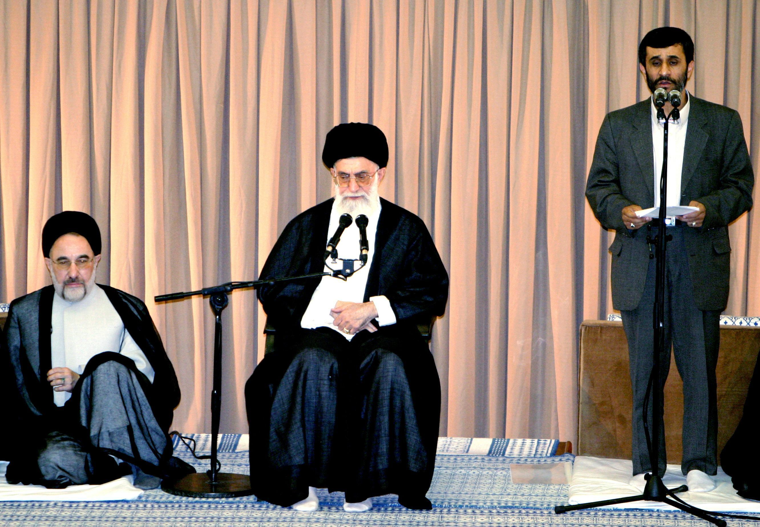 Iran's Supreme Leader Ayatollah Ali Khamenei (C) and former president 