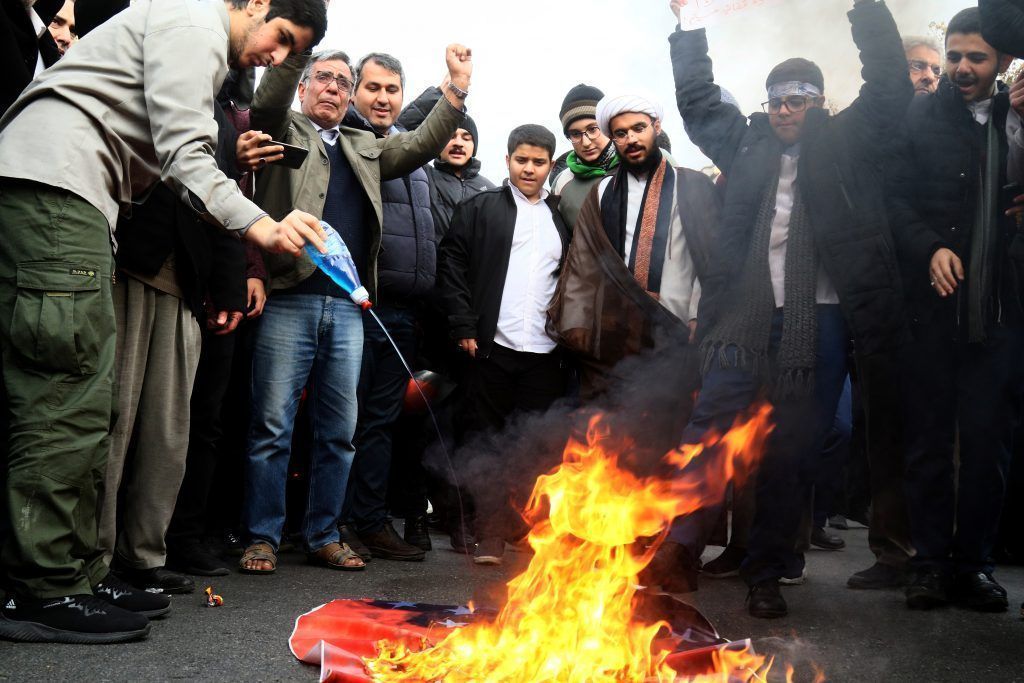 Iranian Pro Government Protesters Burn An U S Flag As