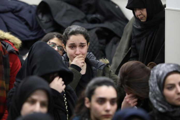 Mourners Attend a Vigil at University of Toronto