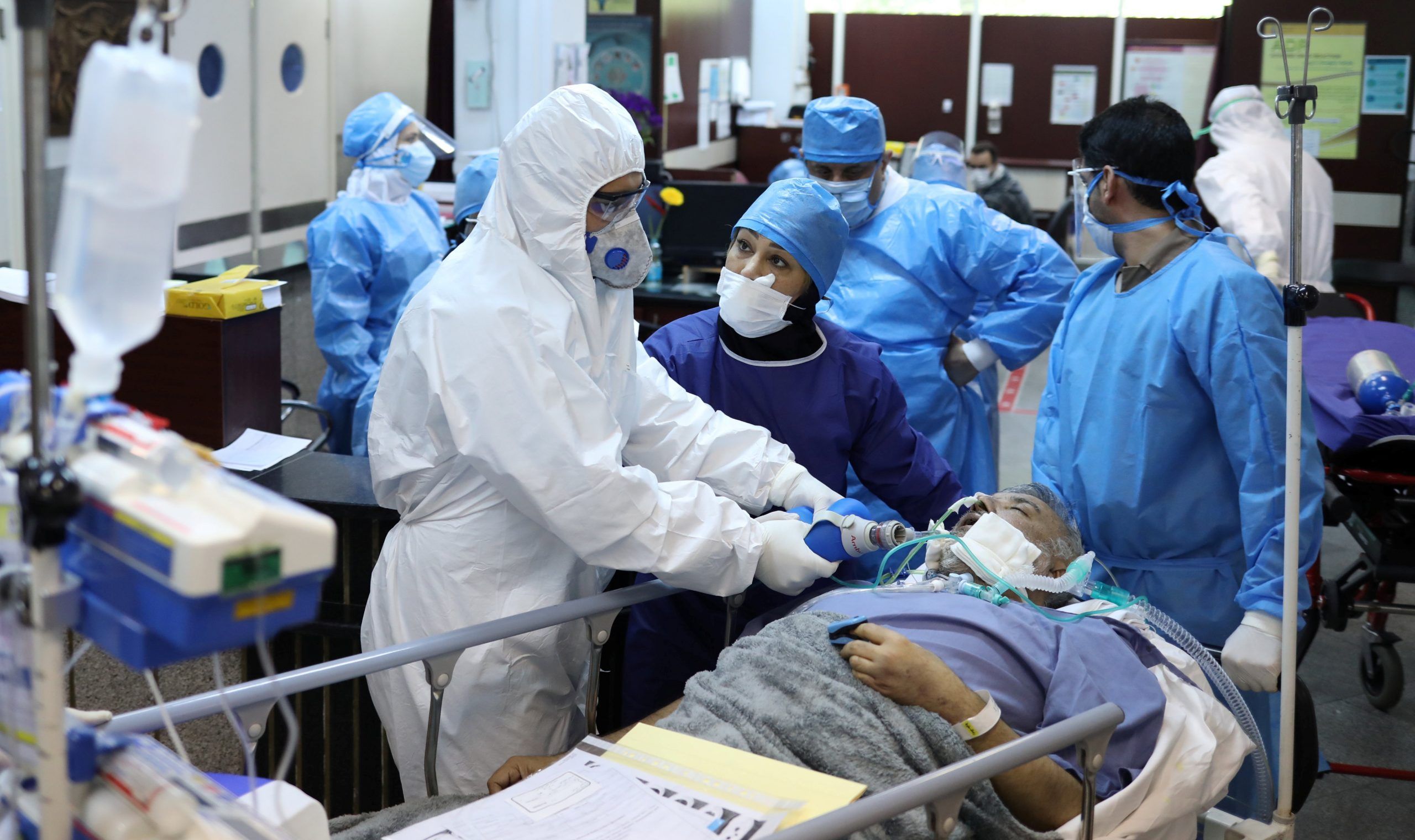 FILE PHOTO: Emergency medical staff and nurses wearing protective suits, help while transferring a patient with coronavirus disease (COVID-19) to Masih Daneshvari Hospital, in Tehran, Iran March 30, 2020. REUTERS./