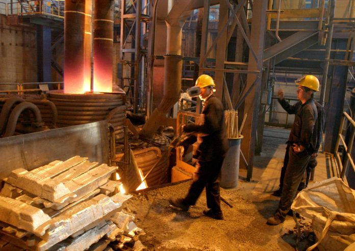 Two Iranian workers are seen at the Steel Saba Complex in Isfahan.
