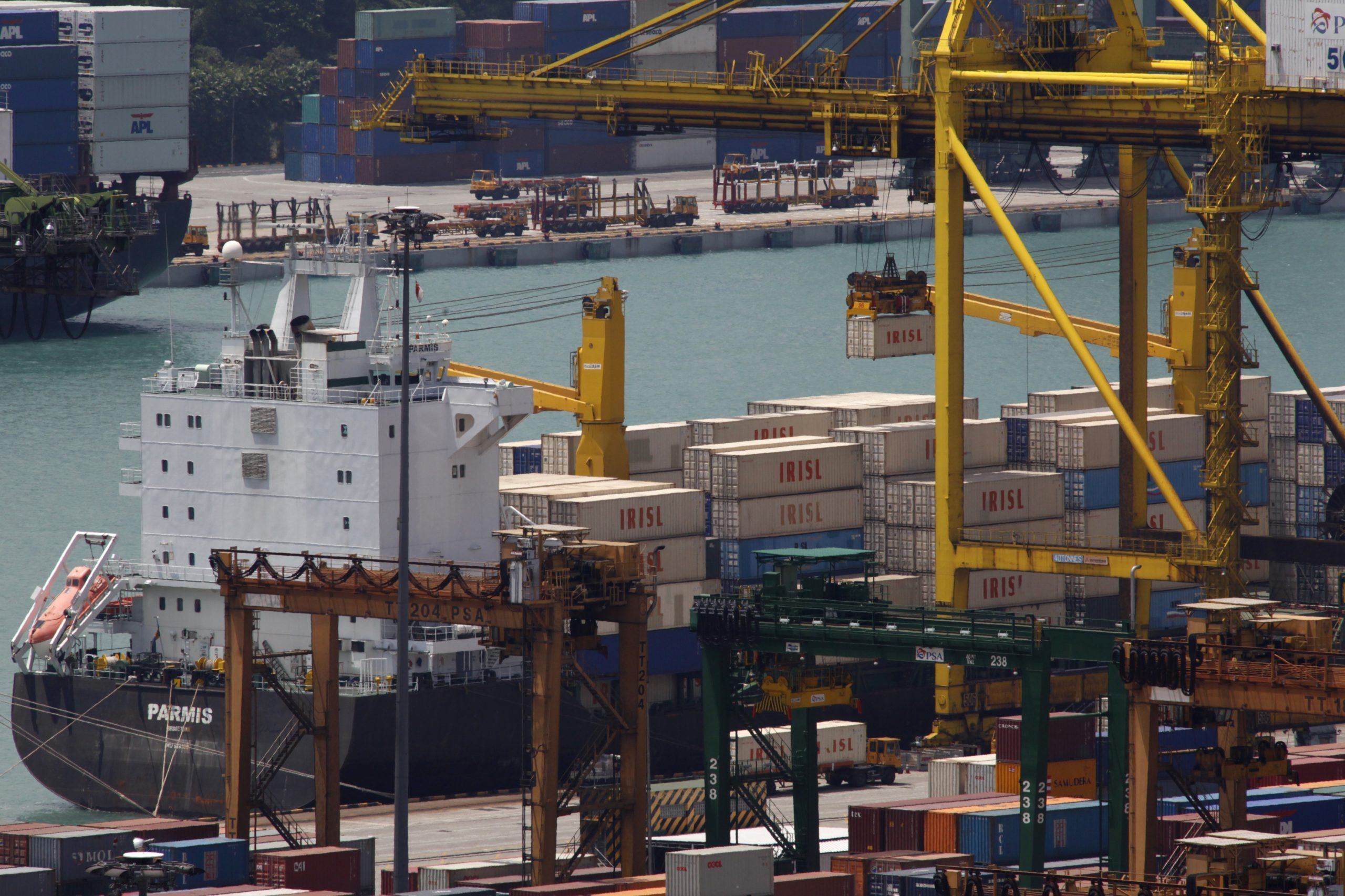 FILE PHOTO: The Parmis is loaded at a dock in Singapore. The IRISL ships and containers are key parts in an international cat-and-mouse game: Iran's attempt to evade the trade sanctions tightening around it. Washington and European capitals want to stop or slow Iran's nuclear programme. They believe that IRISL, which moves nearly a third of Iran's exports and imports and is central to the country's trade, plays a critical role in evading sanctions against shipping controlled weapons, missiles and nuclear technology to and from Iran.   