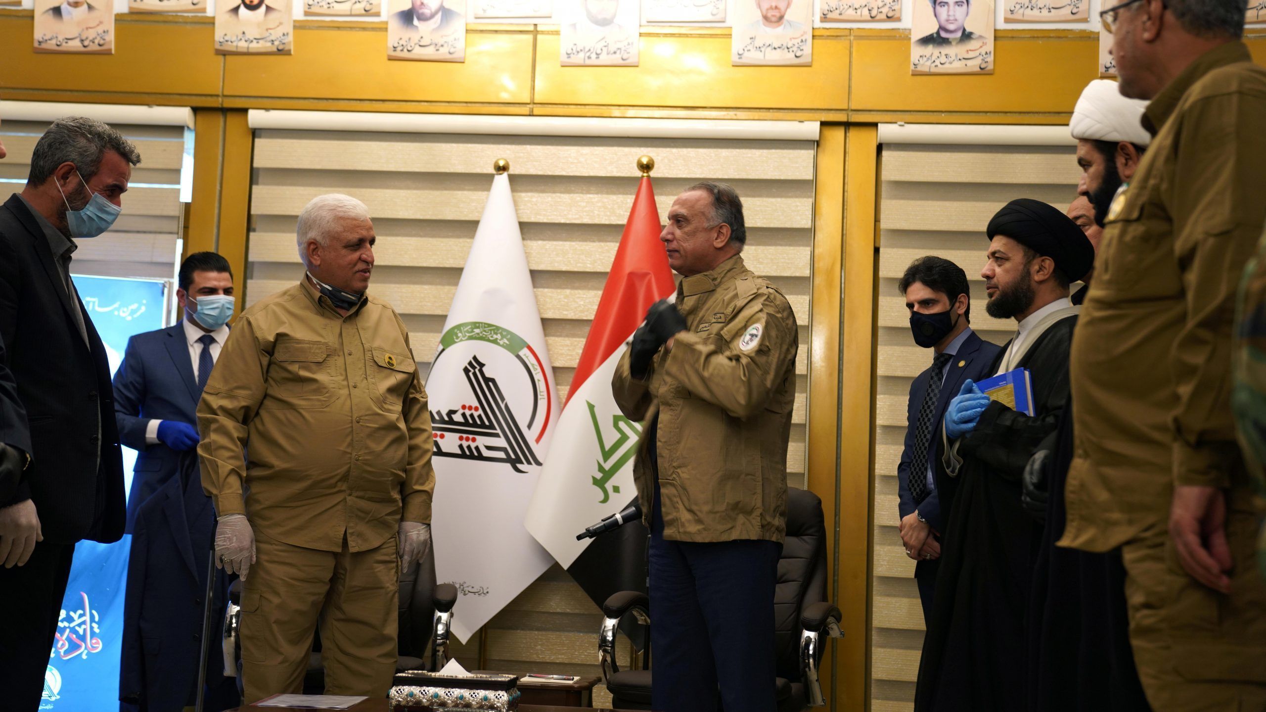 Iraqi Prime Minister al-Kazemi wears a military uniform of Popular Mobilization forces during his meeting with Head of the Popular Mobilization forces Faleh al-Fayyad in Baghdad, Iraq May 16, 2020. REUTERS./