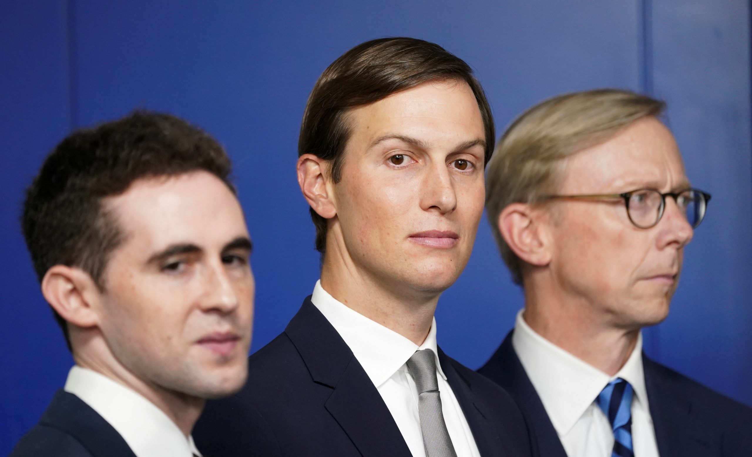White House adviser Jared Kushner, flanked by aide Avi Berkowitz (L) and Brian Hook, former U.S. envoy to Iran, during a press briefing on the agreement between Israel and the United Arab Emirates at White House in Washington, U.S., August 13, 2020.  REUTERS/Kevin Lamarque