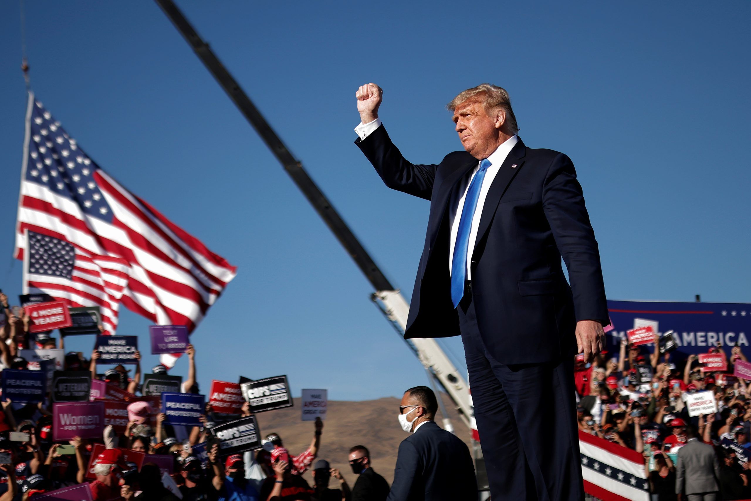 U.S. President Donald Trump raises his fist during a campaign rally in Carson City, Nevada, U.S., October 18, 2020. REUTERS/Carlos Barria
