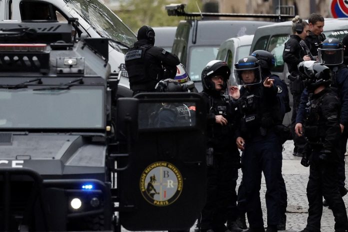 French police cordoned off Iranian consulate in Paris where a man is threatening to blow himself up