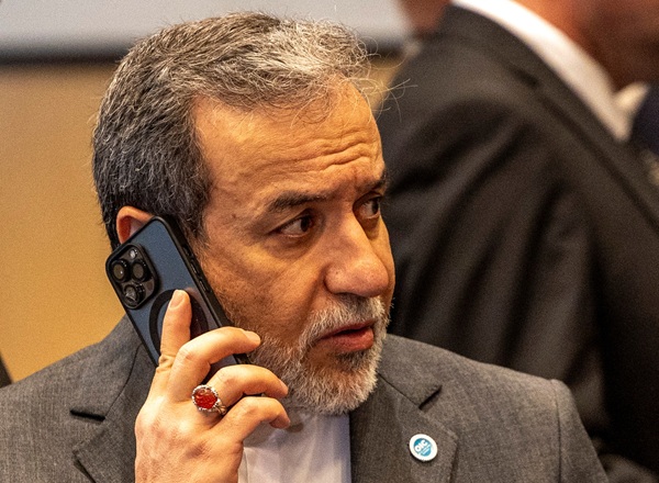 Iranian Foreign Minister Abbas Araghchi makes a phone call during the 51st Session of the Council of Foreign Ministers of the Organisation of Islamic Cooperation in Istanbul