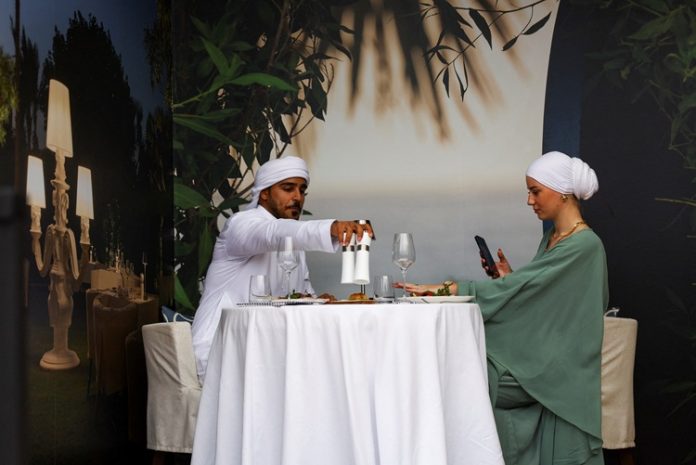A couple is pictured in a restaurant at the Dubai Taste festival as food enthusiasts and international chefs get together for a weekend of culinary activities in Dubai