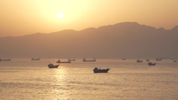 Drone footage shows vessels around Strait of Hormuz at dawn