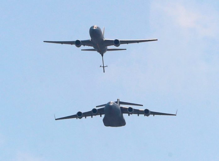 2023-12-30T114758Z_643780490_MT1USATODAY22194746_RTRMADP_3_PLANES-FROM-THE-US-AIR-FORCE-305TH-AIR-MOBILITY-WING-FLY-IN