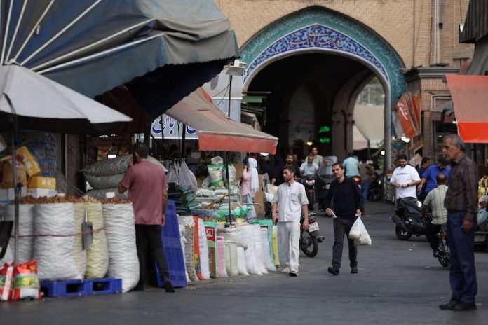 2026-09-28T062736Z_1679580008_RC2YQNADEQK6_RTRMADP_3_IRAN-CRISIS-ECONOMY